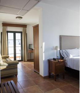 Postel nebo postele na pokoji v ubytování Hotel Tugasa Sierra y Cal