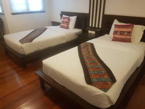 Postel nebo postele na pokoji v ubytování Ping Phu Place