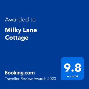 um telefone azul com o texto atribuído a Milley Lane Cottage em Milky Lane Cottage em Mooirivier