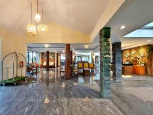 a room with a lobby with a fireplace and a lobby at The Batu Hotel & Villas in Batu