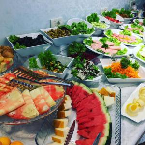 a buffet of different types of food on a table at Auroom Hotel in Baku