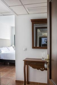 Postel nebo postele na pokoji v ubytování Hotel Tugasa Sierra y Cal
