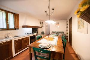 Kuchyň nebo kuchyňský kout v ubytování Casetta di Butia, Mimosa Apartment