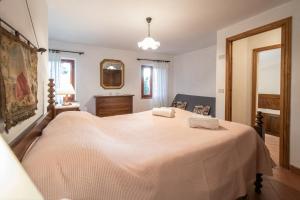 Postel nebo postele na pokoji v ubytování Casetta di Butia, Mimosa Apartment