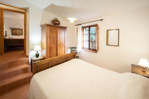 Postel nebo postele na pokoji v ubytování Casetta di Butia, Mimosa Apartment