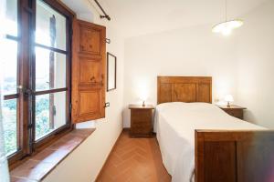 Postel nebo postele na pokoji v ubytování Casetta di Butia, Mimosa Apartment