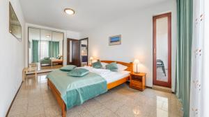 Posteľ alebo postele v izbe v ubytovaní Apartamenty Sun & Snow Marea