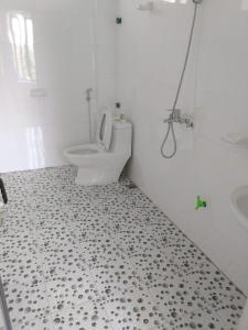 a bathroom with a toilet and a sink at Tuyet's hostel in Ninh Binh +39 photos