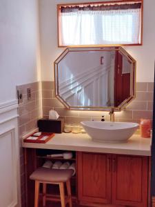 a bathroom with a sink and a large mirror at 그공간 in Jeju +34 photos