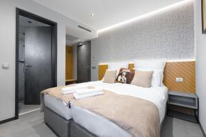 Postel nebo postele na pokoji v ubytování Victoria Interpark Hotel