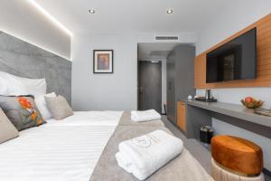 Postel nebo postele na pokoji v ubytování Victoria Interpark Hotel