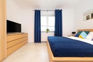 Posteľ alebo postele v izbe v ubytovaní DreamHouse Apartament Timone Północna Darłówko Wschodnie