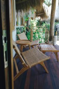 two chairs and a table on a patio at Mana Eco Retreat in Kuta Lombok