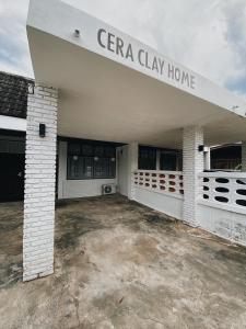 a white building with a sign that reads cara clay home at Ceraclay Home in Nan