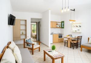 a living room with a couch and a table at Villa Vicky in Hersonissos