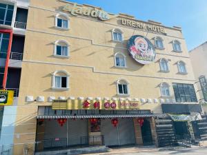 a restaurant with a sign on the side of a building at Aladdin Dream Hotel in Johor Bahru