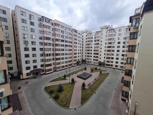an aerial view of a large apartment building at Apartament, sectorul Buiucani in Chişinău