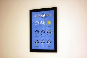 a picture of a sign on a wall at Oakwell View - Modern 3 Bed Home in Barnsley