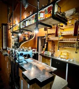 a kitchen with a sewing machine on a counter at HARABURDI® Recyclart Hotel in Kostelec nad Orlicí