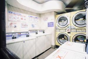 a washer and dryer room with two washing machines at *Beautiful, Sunny, & Quiet Apt Close to Metro in Tokyo