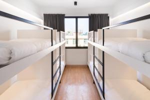 a room with four bunk beds with a window at CASA BLANCA Dusit in Dusit +30 photos