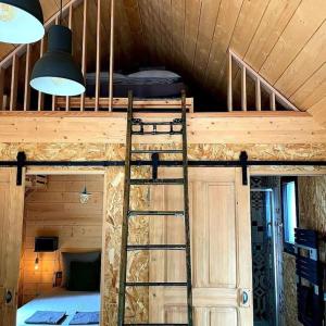 Postel nebo postele na pokoji v ubytování Une pause là-haut!