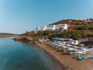 a group of umbrellas and chairs on a beach at Hotel Perrakis in Kipri