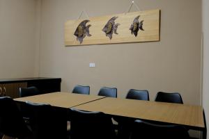 a conference room with a table and chairs at 喜苑民宿 in Jinhu