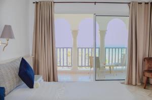 Kama o mga kama sa kuwarto sa Hotel El Habib Monastir