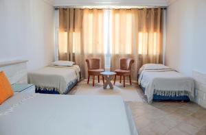 Kama o mga kama sa kuwarto sa Hotel El Habib Monastir