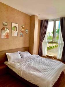 Postel nebo postele na pokoji v ubytování LaLa Homestay