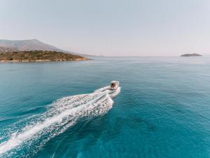 a boat in the middle of the water at Hotel Perrakis in Kipri