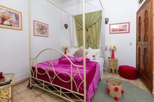 Postel nebo postele na pokoji v ubytování Riad Aquarelle By GE