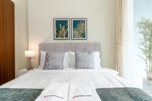 Una cama o camas en una habitación de Sparking 2 BR at Vera Residences