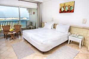 Kama o mga kama sa kuwarto sa Hotel El Habib Monastir