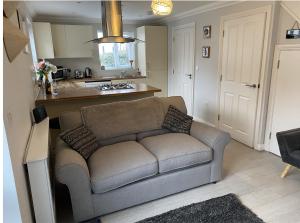 a living room with a couch in a kitchen at Modern House in Bournemouth town centre in Bournemouth