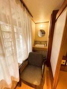 Postel nebo postele na pokoji v ubytování Sangai Ryokan