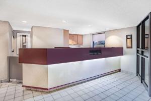 a large kitchen with a counter in a room at Travelodge by Wyndham Bridgewater in Bridgewater