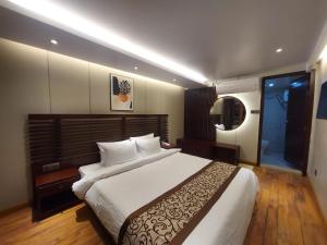 A bed or beds in a room at D' more Sajek Valley Hotel & Resort