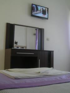 TV a/nebo společenská místnost v ubytování Reis Maris Hotel