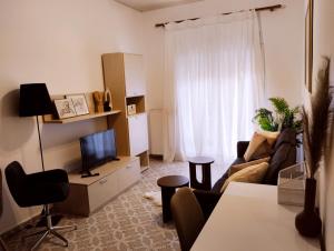 Televízia a/alebo spoločenská miestnosť v ubytovaní SnD Rentals -Boutique apartments