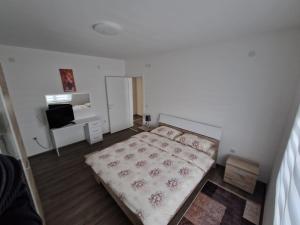 Postel nebo postele na pokoji v ubytování Apartman Paradiso