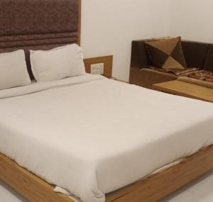 Postel nebo postele na pokoji v ubytování Hotel Maan Palace