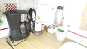 a kitchen counter with a blender and other appliances at Στουντιο στο Πανοραμα in Thessaloniki