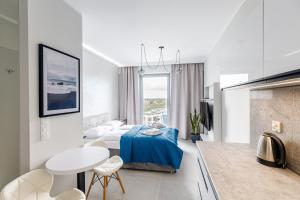 Łóżko lub łóżka w pokoju w obiekcie Balticus Apartamenty Standard Promenada Gwiazd 14