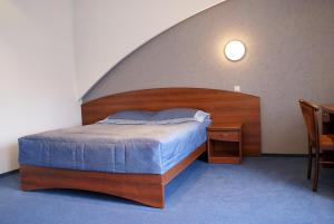 Кровать или кровати в номере Отель 55 Широта