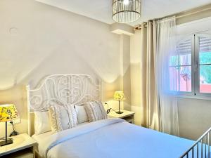 Łóżko lub łóżka w pokoju w obiekcie Alvarito Beach - EaW Homes