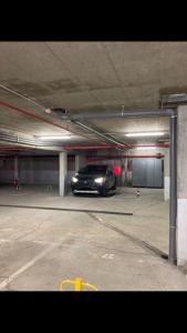 a car is parked in a parking garage at Apartman Jelka Brzece in Brzeće