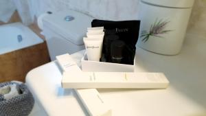 a box of products sitting on top of a toilet at Villa Stamatis in Áyioi Apóstoloi +107 photos