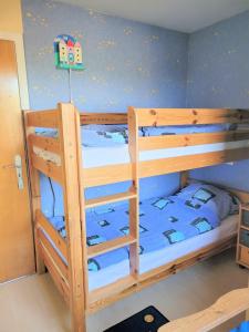 a bunk bed room with two bunk beds at Ferienwohnung 3 - a76814 in Groß Vollstedt